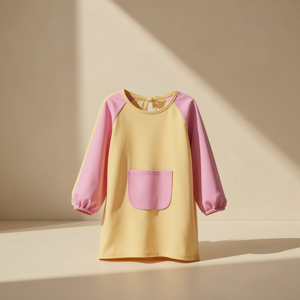 Children’s breathable long-sleeve painting smock in a solid color