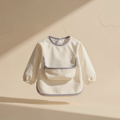 Long-sleeve toddler feeding bib with an enlarged pocket