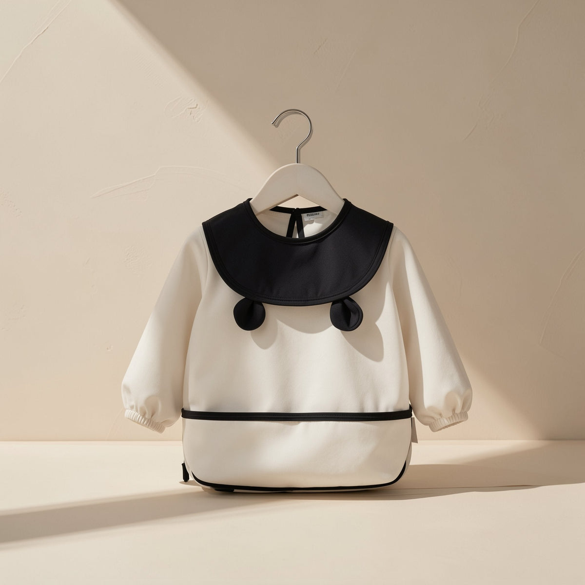 Long-sleeve feeding bib made from 100% polyester fiber