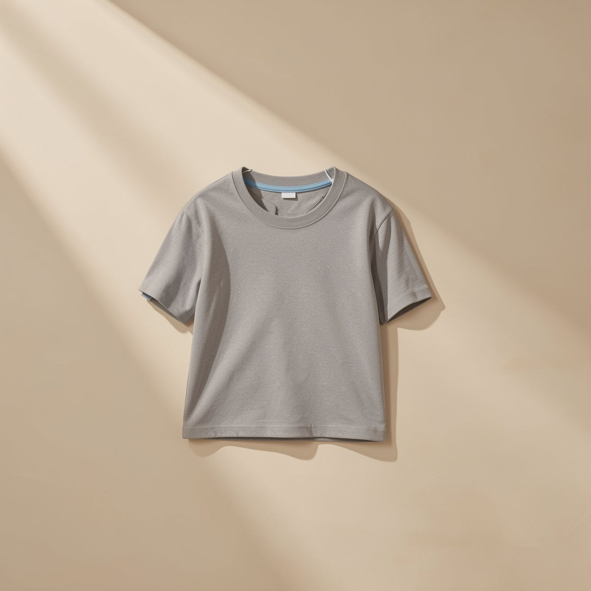 Solid-color kids' cotton T-shirt with short sleeves and a round neckline